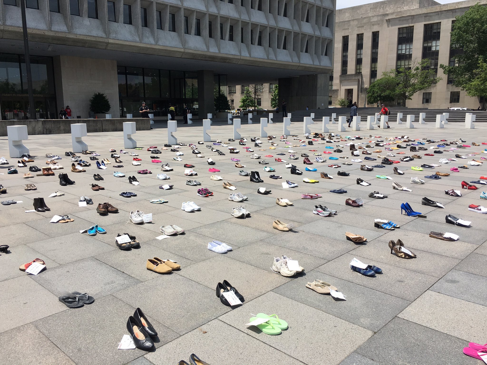 An image of shoes outside a building.