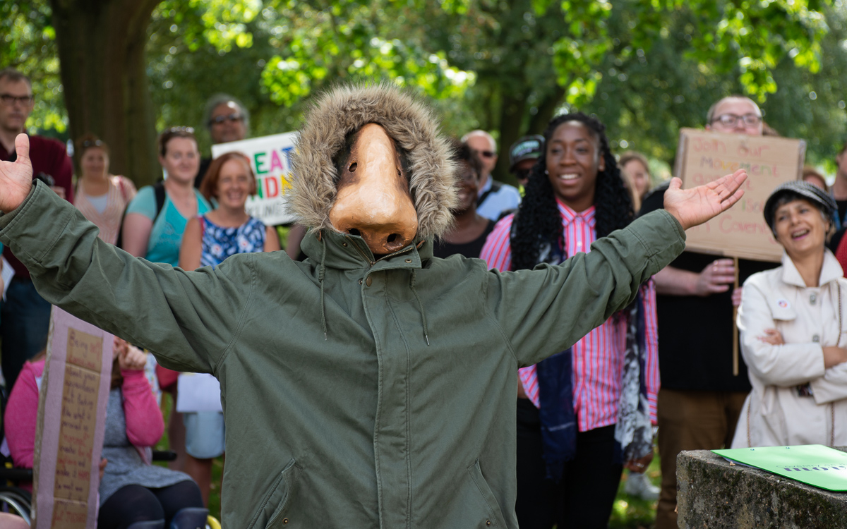 An image of a boy in a parker jacket with a nose for a face.