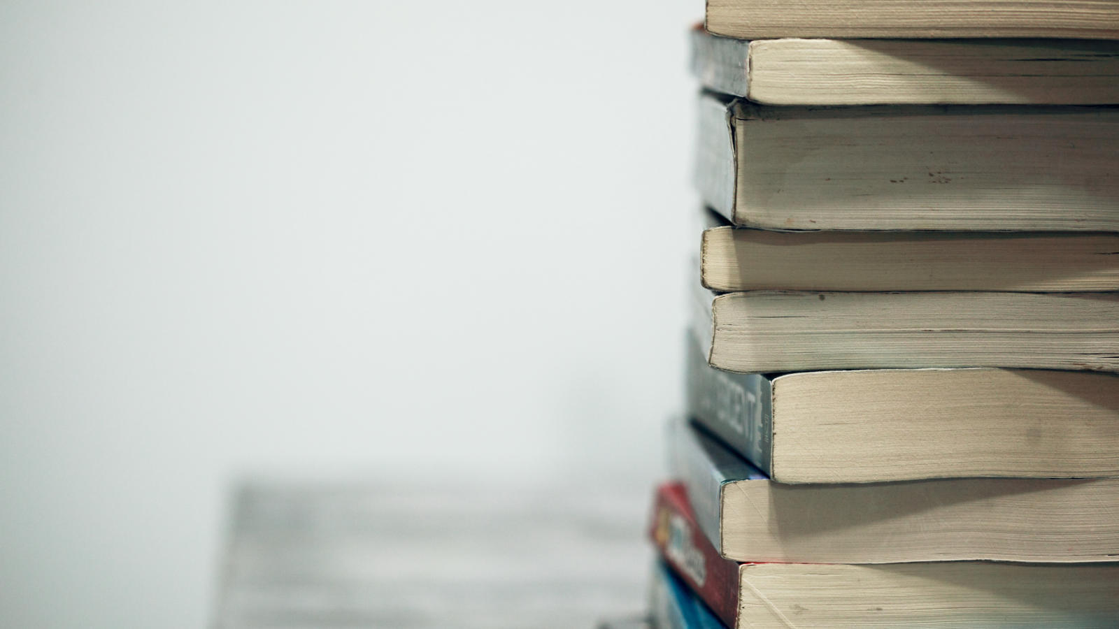 An image of books in a pile.